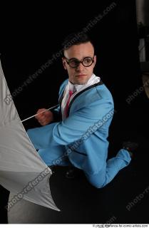 MIKAEL KNEELING POSE WITH UMBRELLA